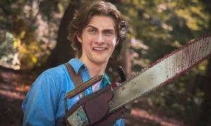 A man smiling with a chainsaw for a hand. 