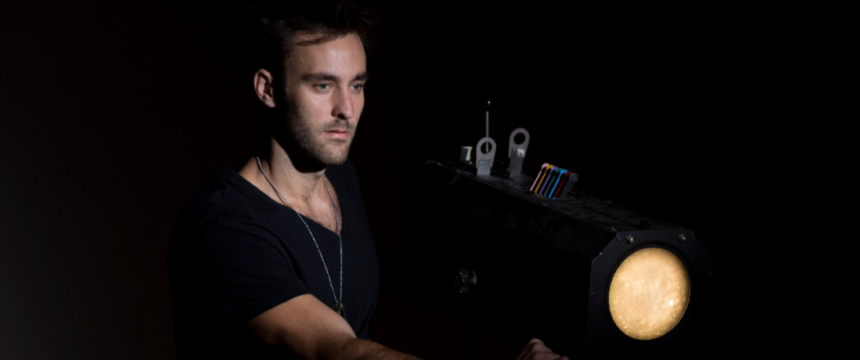 A Theatre and Film Studies student operates a performance lighting against a white background.